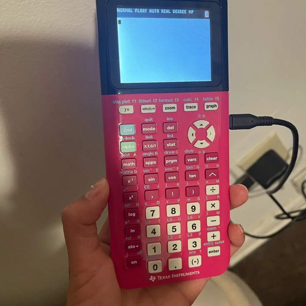 Texas Instruments Pink Graphing Calculator - Picture 1 of 4